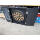 A WINMAU DARTBOARD AND WOODEN DARTBOARD CASE