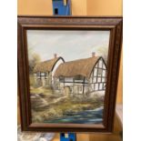 A FRAMED OIL ON CANVAS OF A COUNTRY COTTAGE SIGNED PR FREEMAN