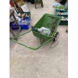 A METAL WHEEL BARROW AND A GARDEN SPRAYER