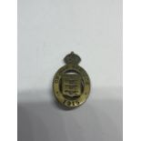 A 1915 ON WAR SERVICE BADGE NUMBERED 66444