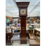 A MODERN LONGCASE CLOCK WITH QUARTZ MOVEMENT AND BULLEYE WINDOW IN DOOR