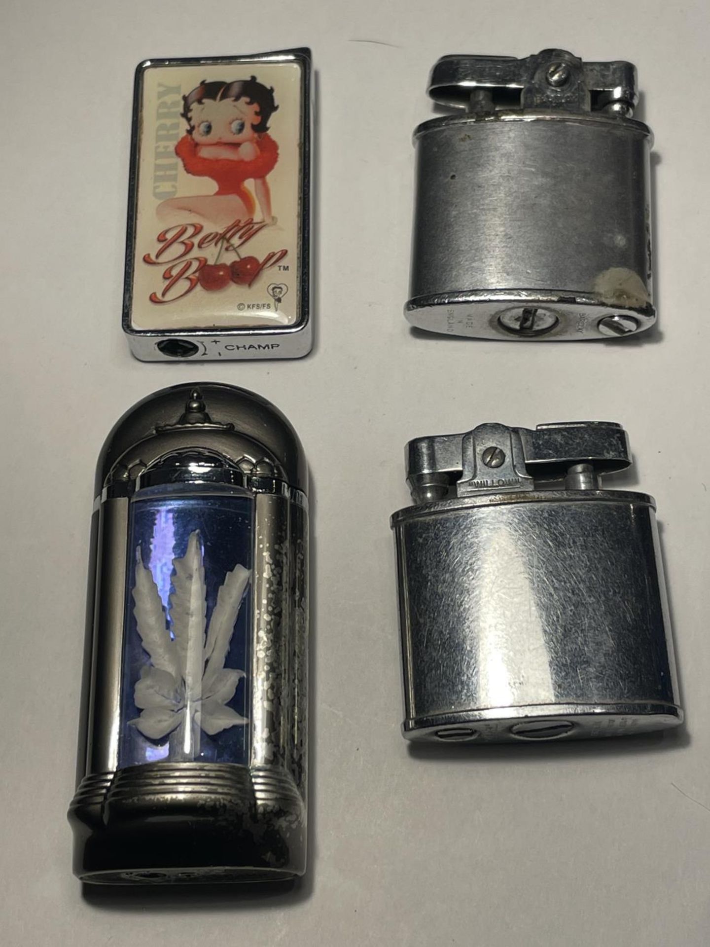 FOUR VARIOUS VINTAGE CIGARETTE LIGHTERS ONE BETTY BOO