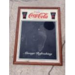 A RETRO COCA COLA ADVERTISING BOARD