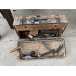 A VINTAGE WOODEN JOINERS CHEST WITH AN ASSORTMENT OF TOOLS TO INCLUDE SPANNERS, SET SQUARES AND SAWS