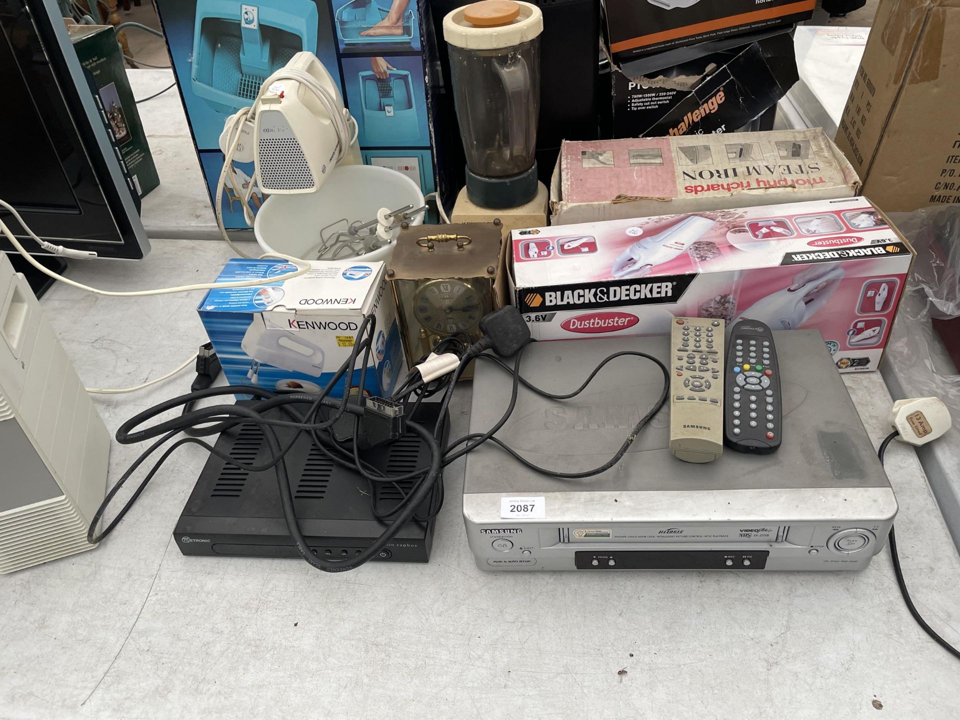 AN ASSORTMENT OF ITEMS TO INCLUDE A SAMSUNG VHS PLAYER, A DUST BUSTER AND FOOD MIXERS ETC