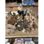 A LARGE QUANTITY OF COLLECTABLES MAINLY ANIMALS TO INCLUDE ELEPHANTS, PIGS, CATS, DOGS ETC