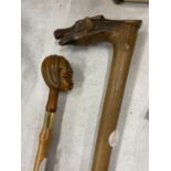 TWO COLLECTABLE ITEMS - SHOE HORN WITH GIRL'S HEAD AND WALKING STICK WITH HORSE HEAD TOP