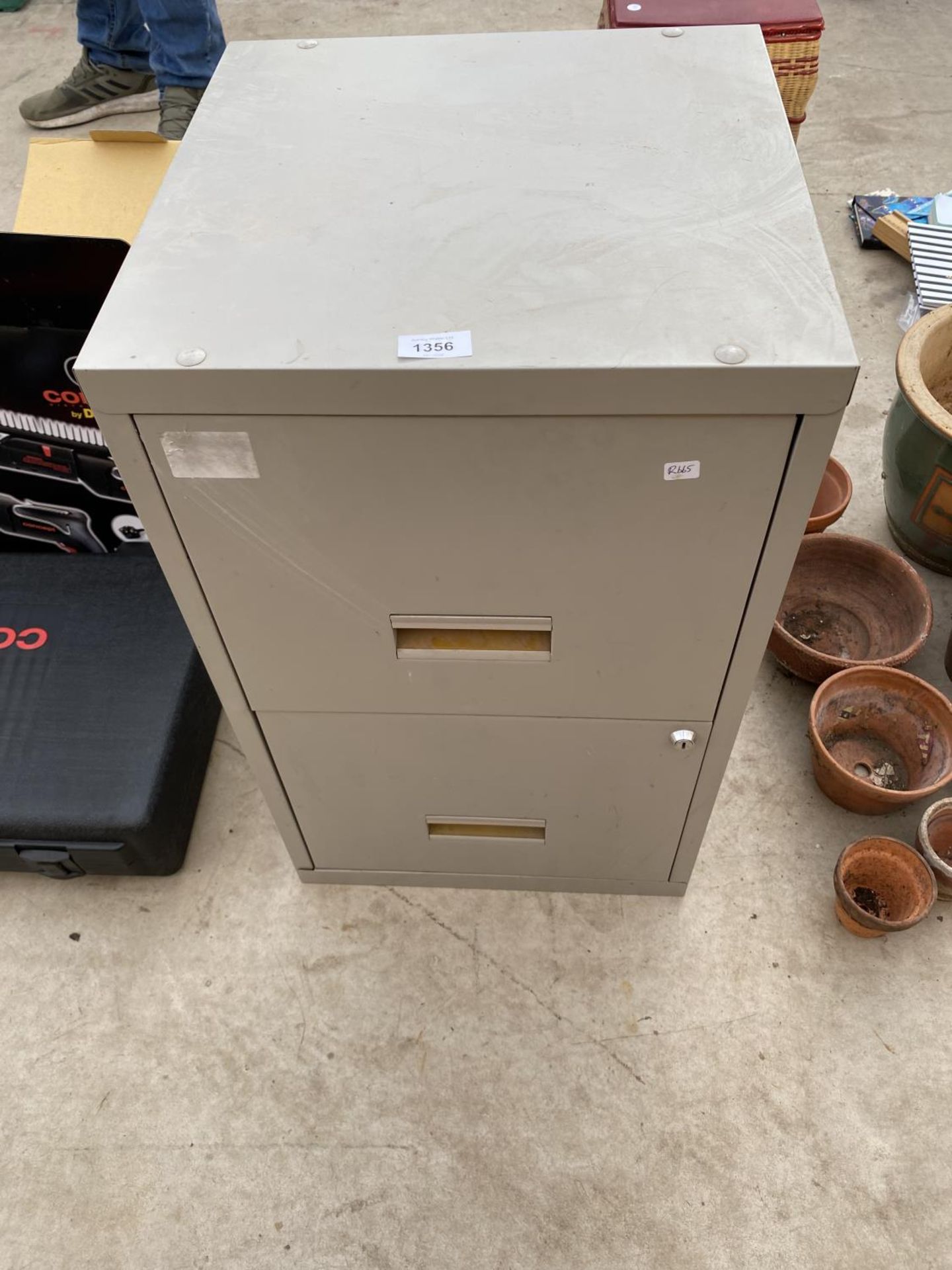 A TWO DRAWER METAL FILING CABINET