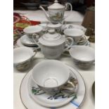 AN ORIENTAL TEASET WITH A GEISHA GIRL SILHOUETTE IN THE CUPS TO INCLUDE TEAPOT, CREAM JUG, SUGAR