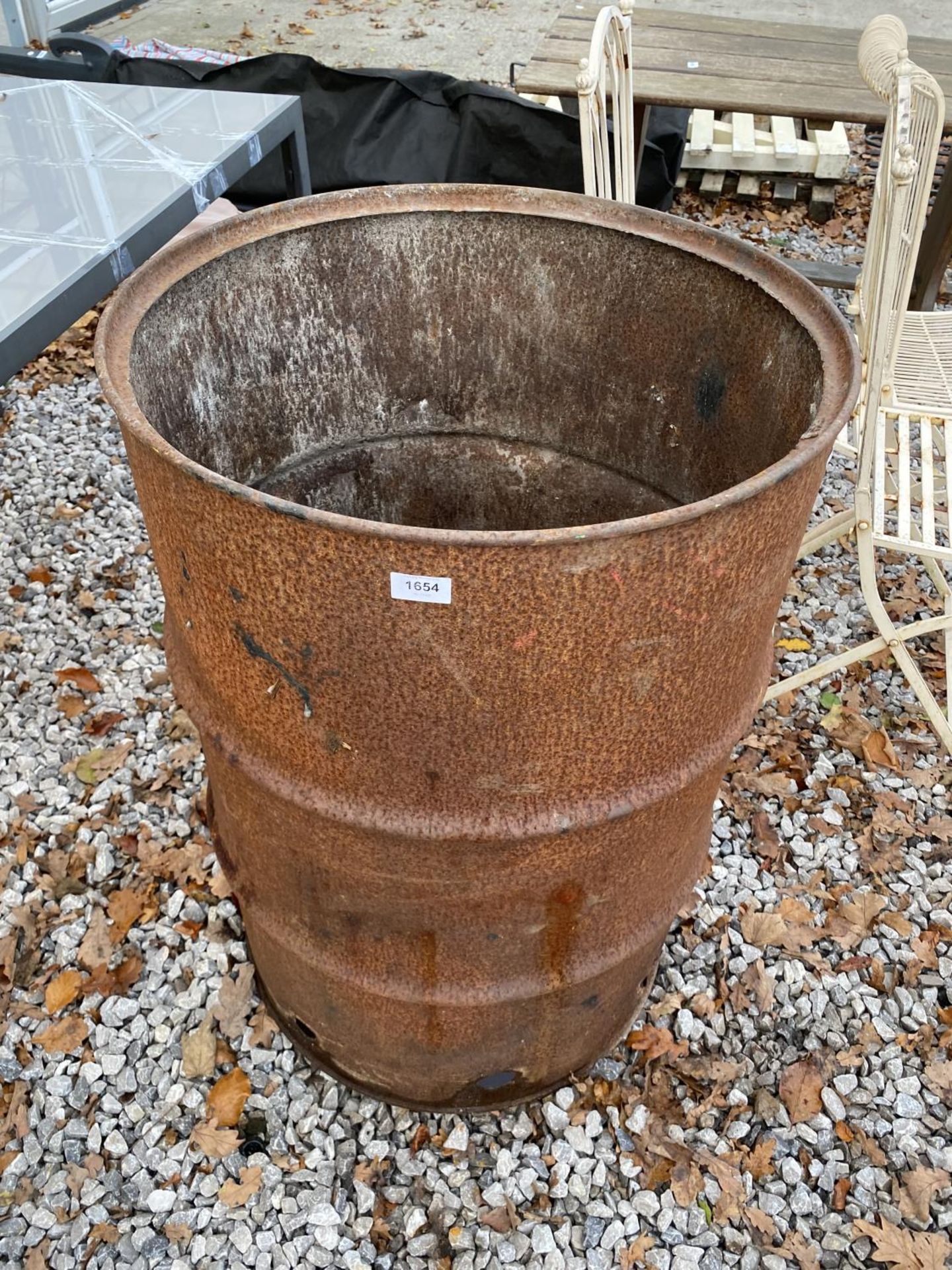 A LARGE DRUM BURNING BIN