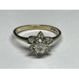 A 9 CARAT GOLD RING WITH SEVEN DIAMONDS IN A CLUSTER DESIGN SIZE N/O