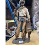 A LEONARDO COLLECTION FIGURE OF A COWBOY HEIGHT 46CM