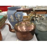 A VINTAGE BRASS AND COPPER KETTLE