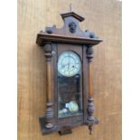 A VINTAGE VIENNA STYLE OAK WALL CLOCK COMPLETE WITH PENDULUM