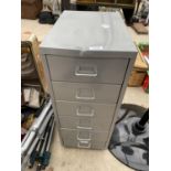 A MINITURE SIX DRAWER FILING CABINET