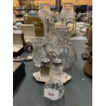 A QUANTITY OF GLASSWARE TO INCLUDE A PAIR OF CUT GLASS CANDLE STICKS ON METAL BASES, A JUG, CRUET