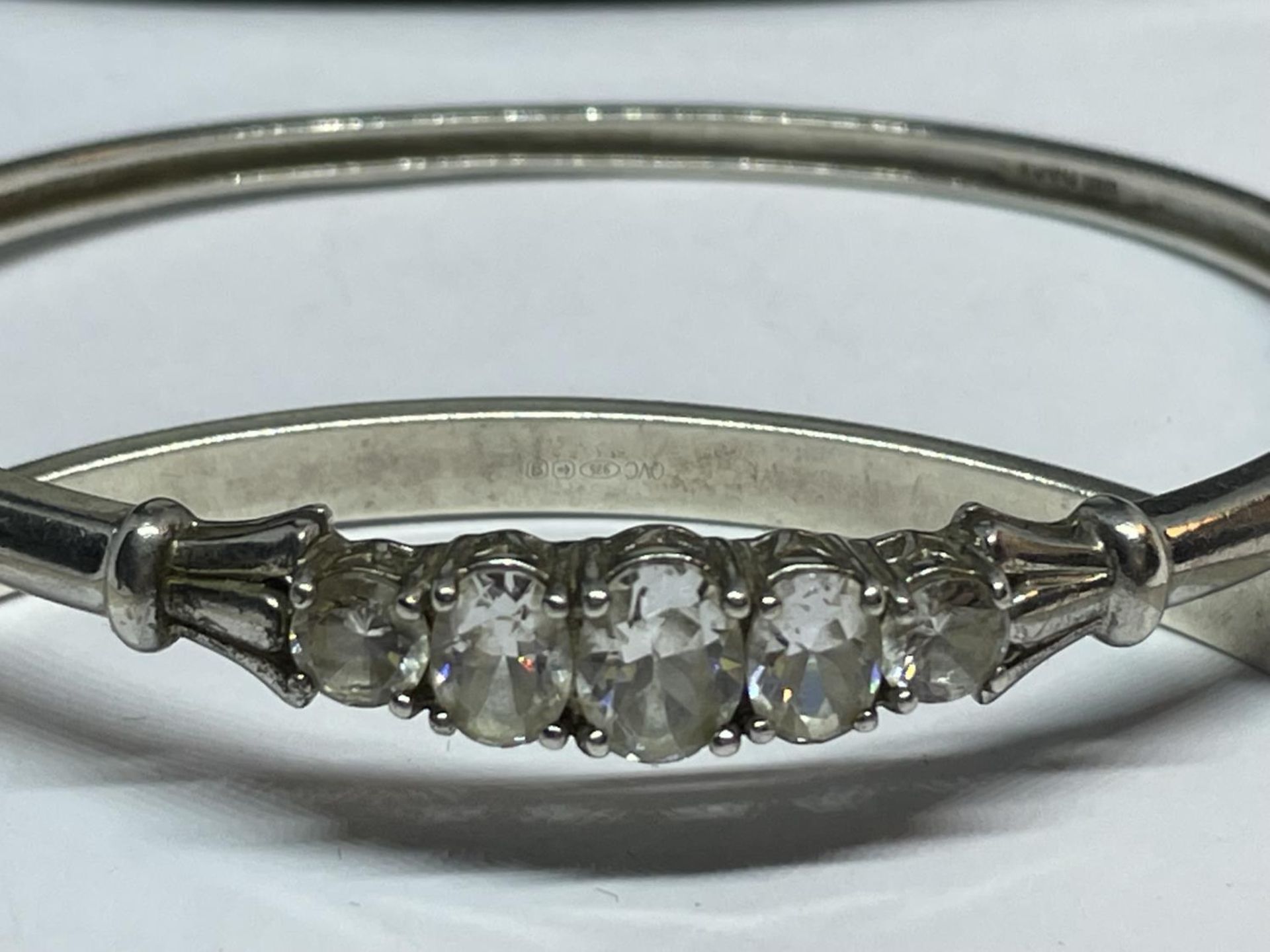 TWO SILVER BANGLES WITH CLEAR STONES IN A PRESENTATION BOX - Image 2 of 3