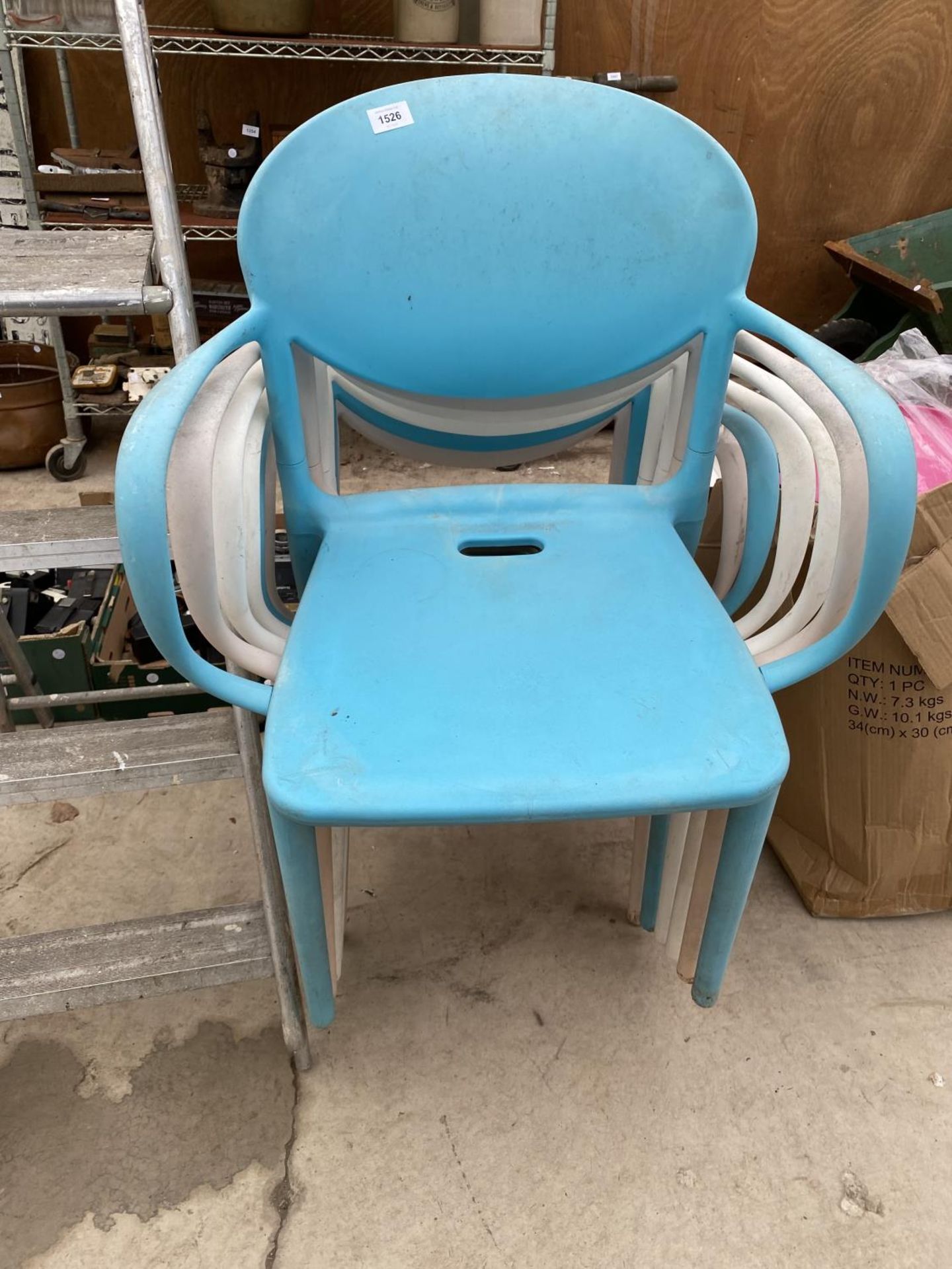 SIX HARD PLASTIC STACKING CHAIRS