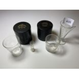 A PAIR OF VICTORIAN LEATHER CASED MEDICINE GLASSES AND FURTHER ETCHED GLASS MEASURE