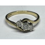 A 9 CARAT GOLD RING WITH CUBIC ZIRCONIAS ON A TWIST DESIGN SIZE O/P