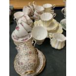 A QUANTITY OF VINTAGE TEAWARE TO INCLUDE A YELLOW AND WHITE FLUTED DESIGN, ROSE PATTERNED, ETC -