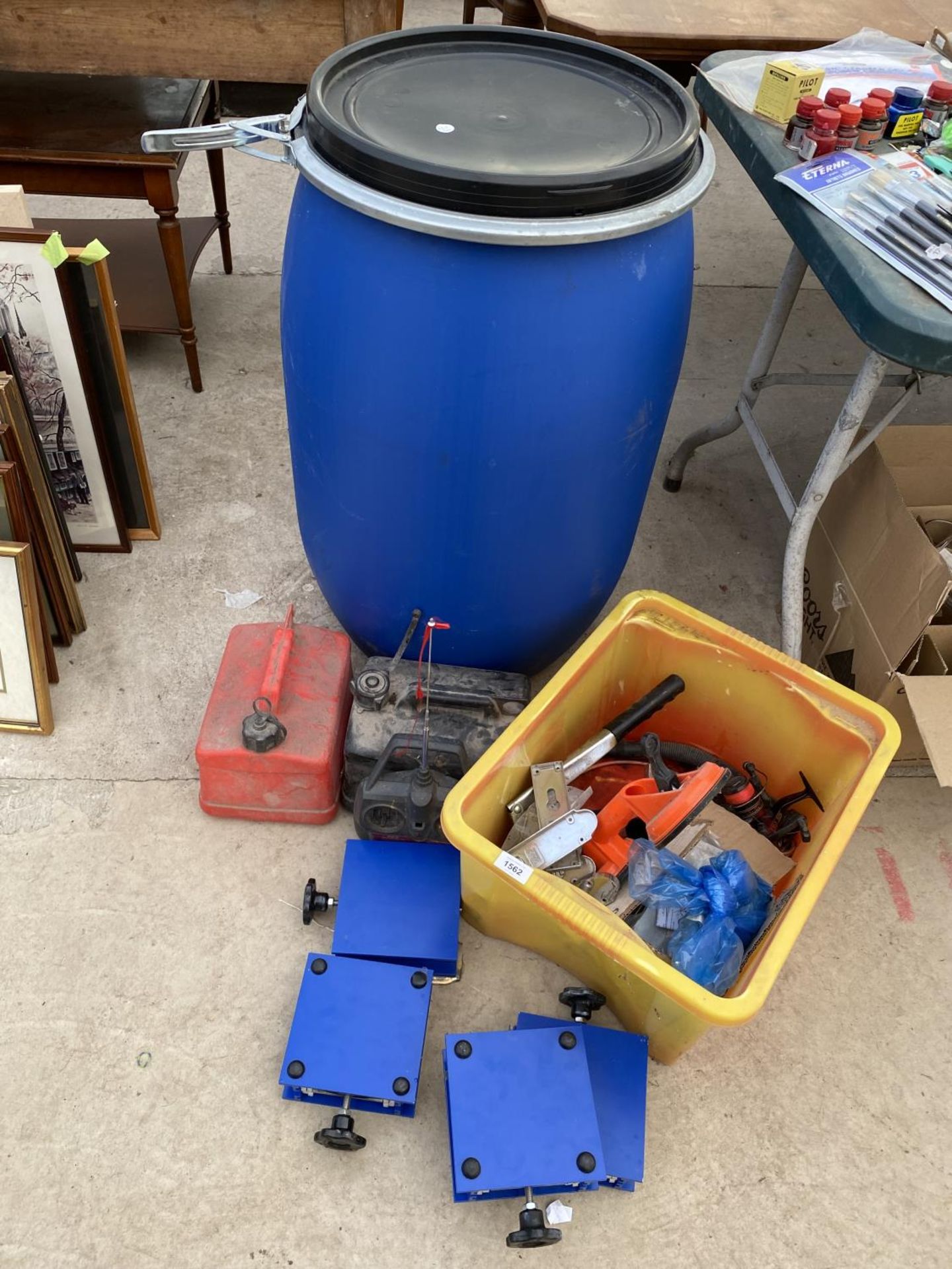 AN ASSORTMENT OF ITEMS TO INCLUDE A STORAGE BIN, GFUEL CANS AND A GREASE GUN ETC