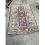 AN ORANGE AND CREAM PATTERNED RUG