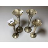 FOUR HALLMARKED SILVER POSY VASES WITH WEIGHTED BASES