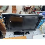 A PHILIPS 32" TELEVISION WITH REMOTE CONTROL