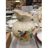 A LARGE FLORAL DECORATED WASH JUG