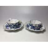 A PAIR OF 19TH CENTURY BLUE AND WHITE PORCELAIN CUPS AND SAUCERS WITH MEISSEN CROSS SWORD MARKS TO