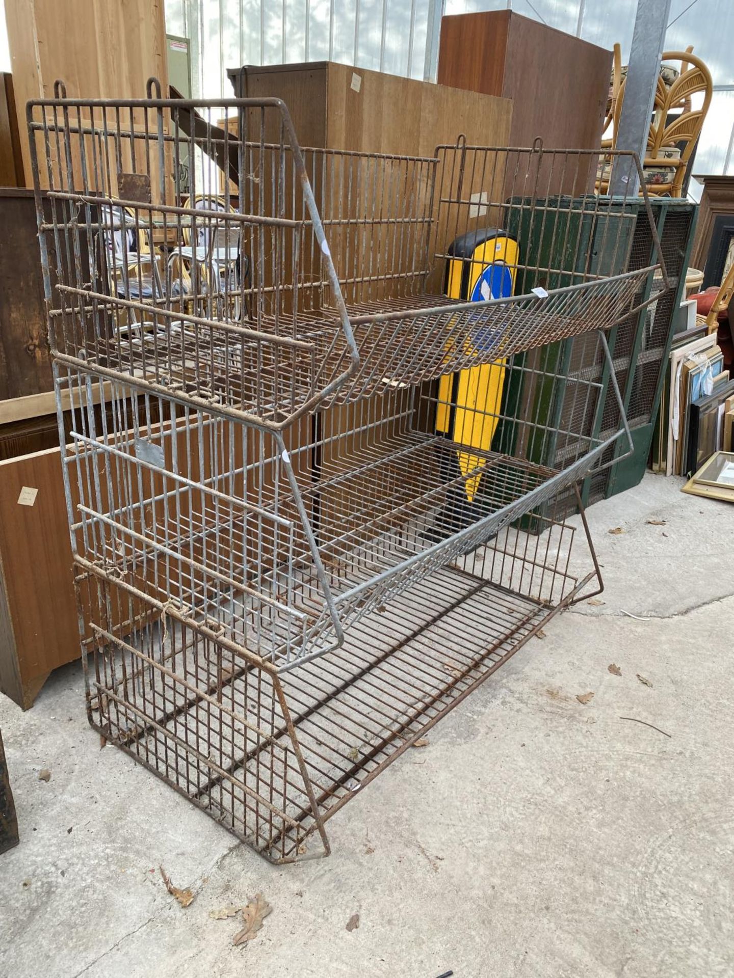 A THREE TIER METAL MESH STACKING STORAGE UNIT