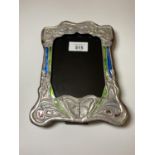 AN ART NOUVEAU STYLE SILVER PHOTO FRAME WITH ENAMEL DESIGN