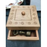 A WOODEN BOX CONTAINING BRASS WEIGHTS