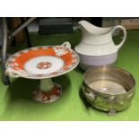 THREE ITEMS TO INCLUDE A PATTERNED PLATE ON A DISH, A LARGE JUG AND A SILVER PLATED BOWL ON FOUR