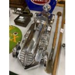 A LARGE DECORATIVE CHROME EFFECT RACING CAR MODEL