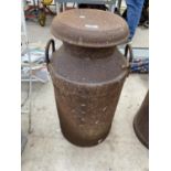 A VINTAGE METAL MILK CHURN WITH LID