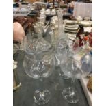 TWO LARGE SHIPS DECANTERS, A LARGE DECANTER AND FOUR LARGE WINE/GIN GLASSES