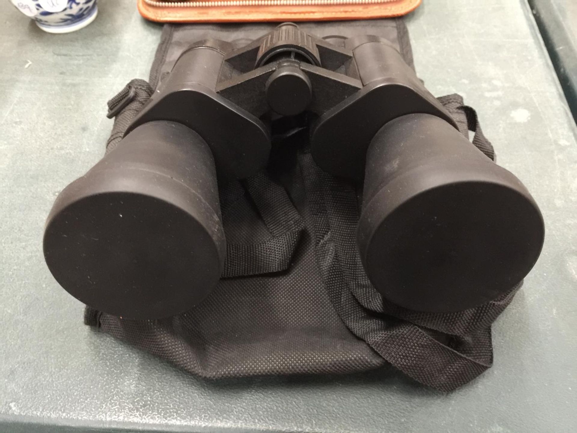 A PAIR OF FIELD BINOCULARS IN A CASE