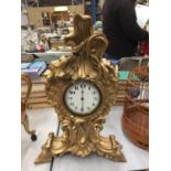 A DECORATIVE WOODEN MANTLE CLOCK WITH GILDED DECORATION