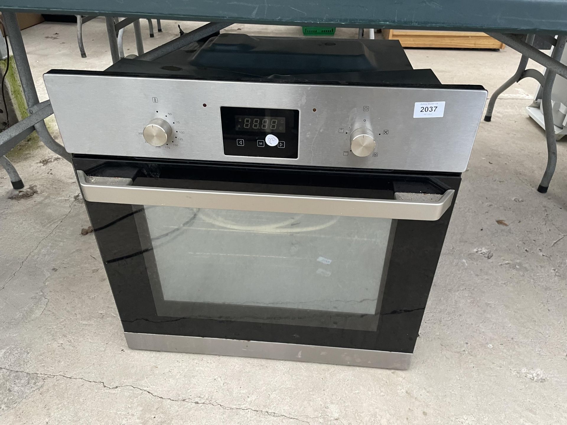 A SILVER AND BLACK INTERGRATED OVEN