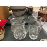 FOUR VINTAGE GLASS WATER JUGS WITH ETCHED AND CUTGLASS DESIGN