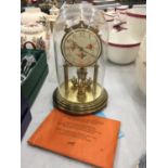 A SCHATZ ANNIVERASRY CLOCK WITH DECORATIVE DIAL WITH KEY AND INSTRUCTION BOOK
