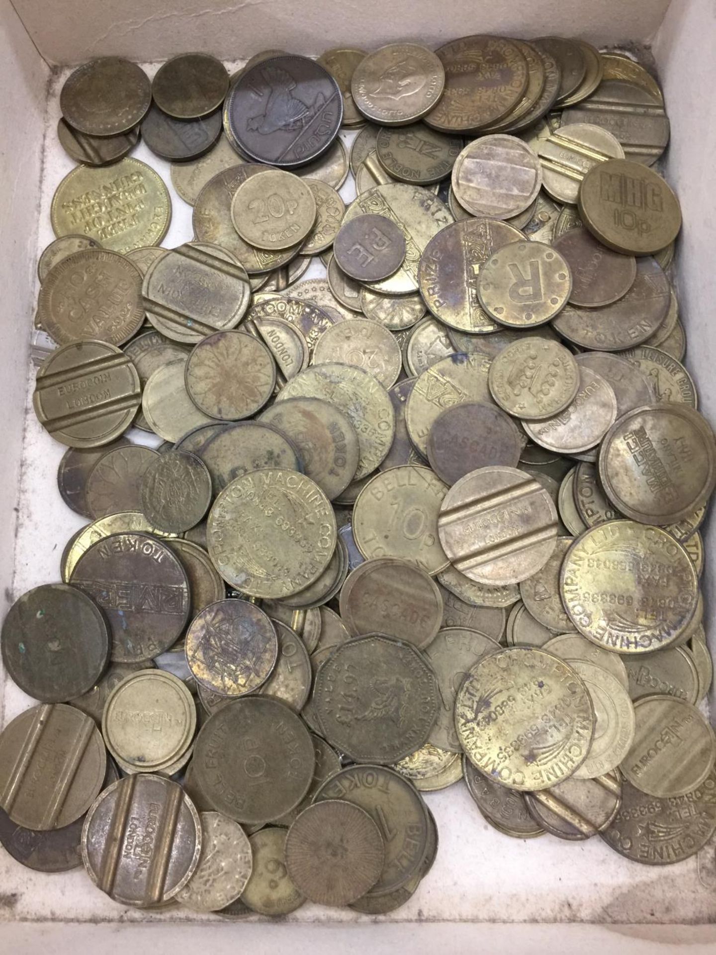 A COLLECTION OF VINTAGE TOKENS, SOME OF WHICH ARE RARE