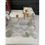 AN ASSORTMENT OF GLASS WARE TO INCLUDE DECANTORS, BOWLS AND VASES ETC