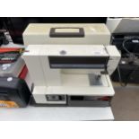 A RETRO TOYOTA ELECTRIC SEWING MACHINE WITH CARRY CASE