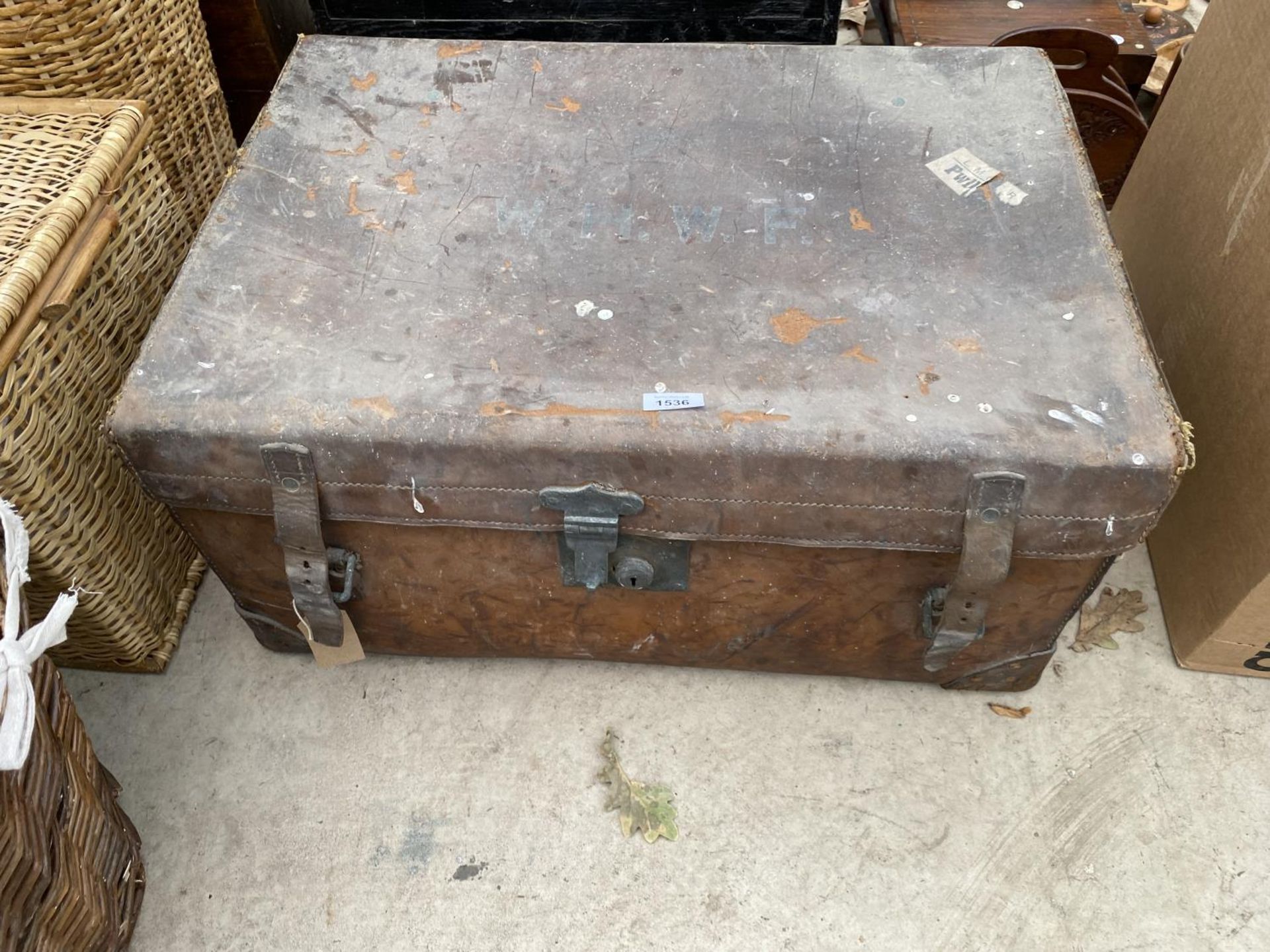 A VINTAGE LEATHER TRAVEL TRUNK