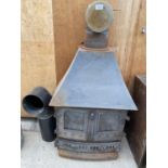 A CAST IRON LOG BURNING STOVE COMPLETE WITH FLU (H:112CM W:59CM D:33CM)