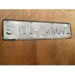 A VINTAGE METAL 'STOCK GROVE' ROAD SIGN