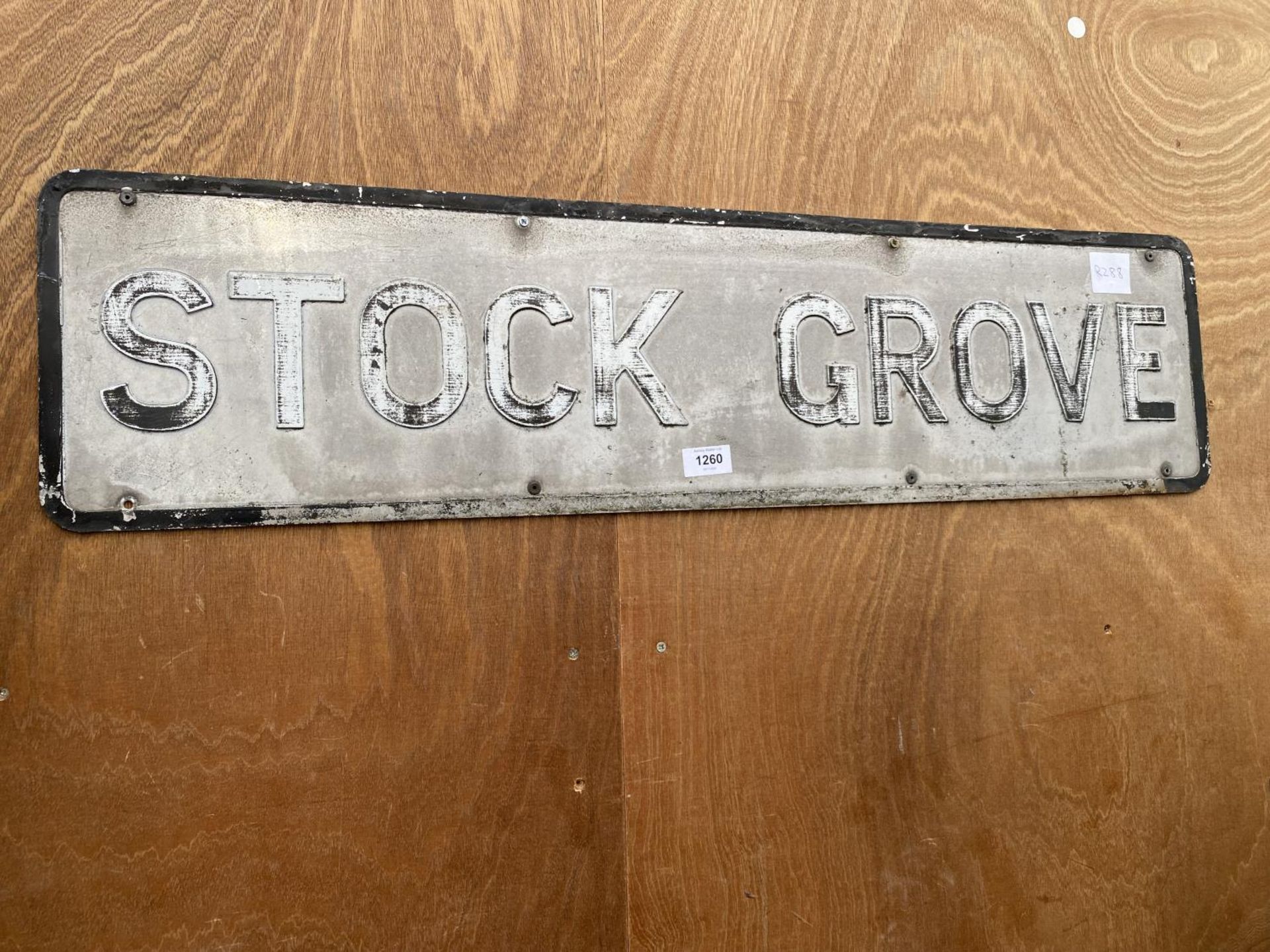 A VINTAGE METAL 'STOCK GROVE' ROAD SIGN